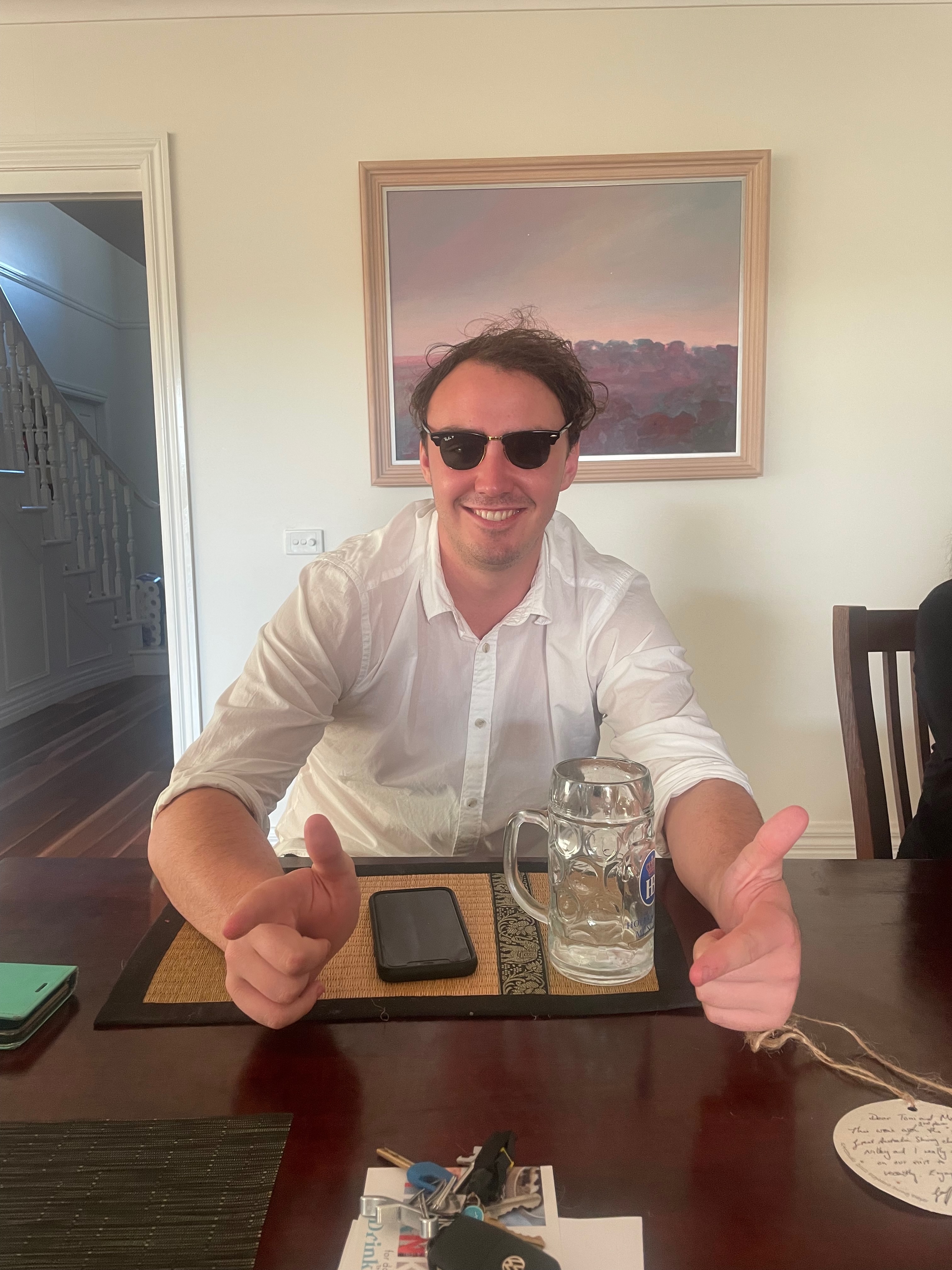Pat Molony in sunglasses at a table — subject of the classified lookalike file